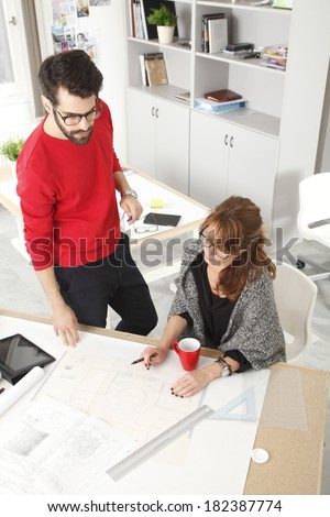 Architects working together in small architect studio.