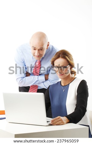 Group of business people with laptop working on project while sitting against white background.