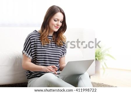 Portrait of female student working on her presentation at home.