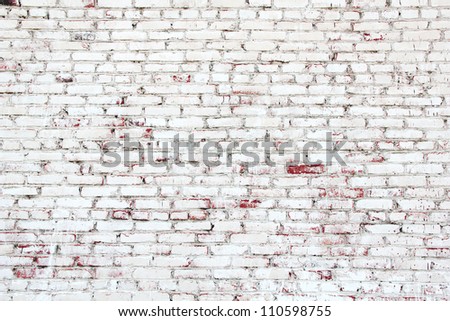 Old brick wall with white and red bricks