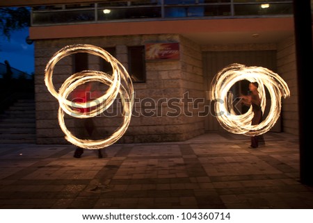 VELIKO TARNOVO, BULGARIA - JUNE 2: Fire dance group performs fire show at club Ozarenie, on June 2, 2012 in Veliko Tarnovo, Bulgaria.