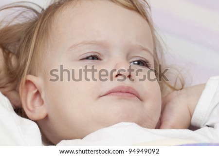 Baby' waking up in bed unhappy