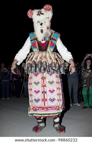 ARBANASSI, BULGARIA - MARCH 24: Kukeri dance group perform a dance to ward away bad spirits during 