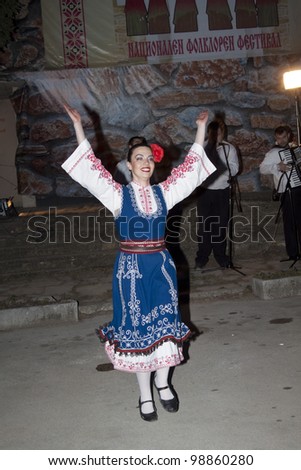 ARBANASSI, BULGARIA - MARCH 24: Veliko Tarnovo\'s dance group perform a traditional ring dance to celebrate \