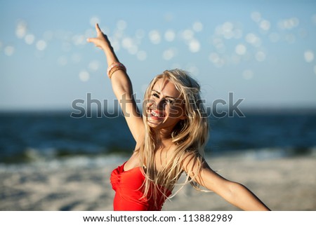 happy young beauty woman on sea beach , birds flying around