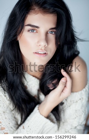 natural portrait of beautiful young womanin warm sweater , sensual look