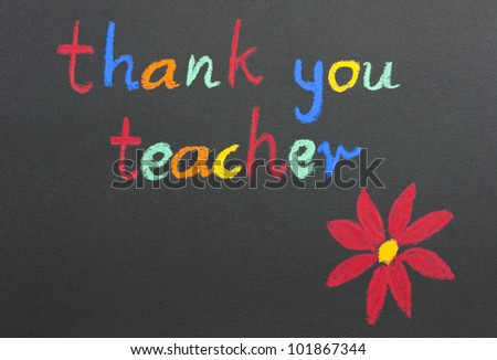 Thank you, teacher message and a red flower on a black background scribbled in a childlike writing with colorful chalks.