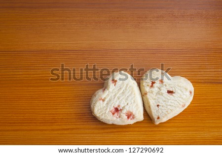 Love hearts strawberry shortcakes on a wooden table. Copy space. Valentine\'s Day concept.