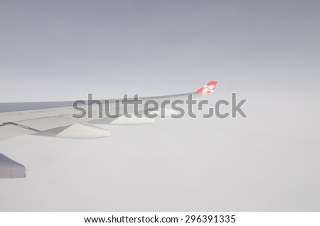 TOKYO, JAPAN - JULY 10: Thai AirAsia X (TAAX) plane\'s wing with logo during fly though Typhoon CHAN-HOM on Pacific sea, the plane flying over Bangkok-Thailand to Tokyo Japan on July 10 2015.