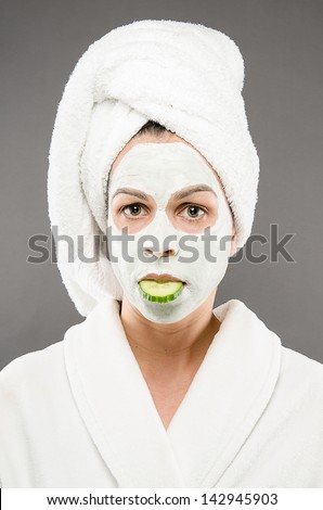 Beauty Mask with Cucumber in Mouth