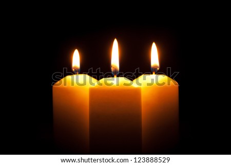 three candles with flame