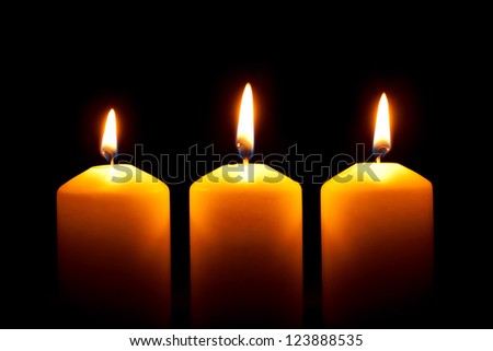 three candles with flame