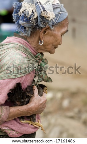 Asia, old woman with chicken