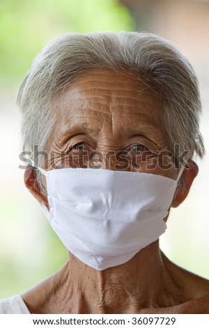 old Asian woman with protective mask