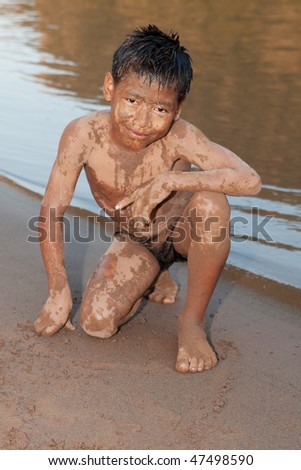 Boy of Asia with sand in the face