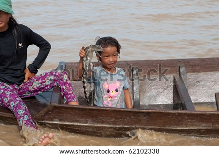 CAMBODIA, Tonle Sap Lake - July15: girl \