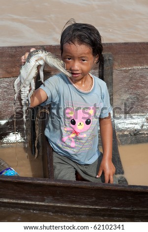 CAMBODIA, Tonle Sap Lake - July15: girl \