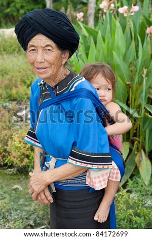 stock photo asian granny piggyback grandchild asian granny