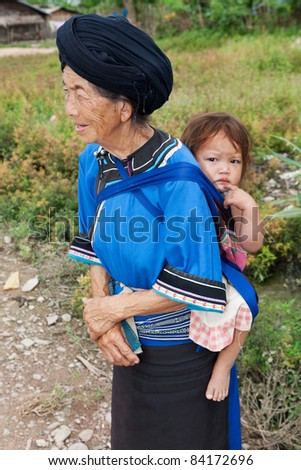 stock photo asian granny piggyback grandchild