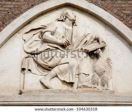 ROME, MARCH - 21: Holy John the Evangelist relief from Santa Maria Aracoeli church facade. March 21, 2012 in Rome, Italy
