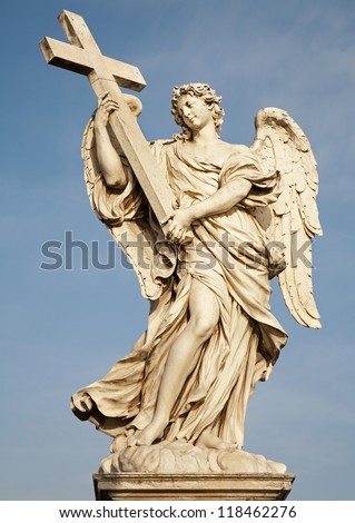 ROME - MARCH 21: Statue of angel  with the Cross in baroque style by sculptor Ercole Ferrata from Angel\'s Bridge in morning light on March 21, 2012 in Rome.