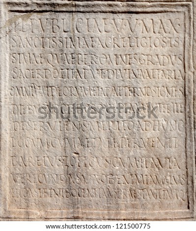 ROME - MARCH 23: Detail of ancient pre - christian latin inscription carved on the stone from Forum Romanum on March 23, 2012 in Rome.