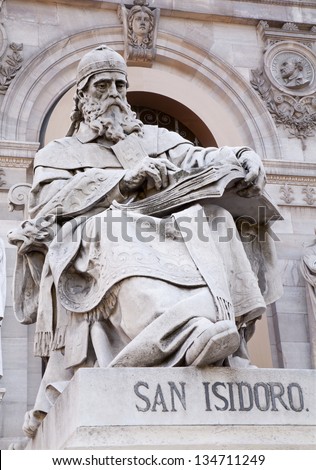 MADRID - MARCH 11: Saint Isidore of Seville from Portal of National Archaeological Museum of Spain projected by architect Francisco Jareno and built from 1866 to 1892 on March 11, 2013 in Madrid.