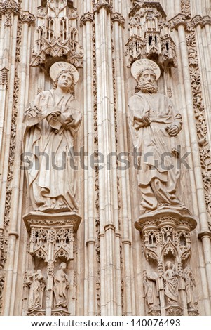 TOLEDO - MARCH 8: Apostle Peter and John from south gothic portal of Cathedral Primada Santa Maria de Toledo on March 8, 2013 in Toledo, Spain.