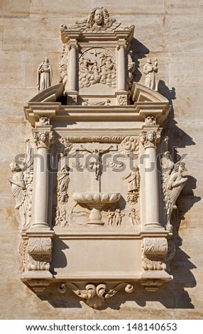 VIENNA - JULY 27:  Tomb stone with the crucifixion of Jesus relief from west facade of monastery church in Klosterneuburg on July 27, 2013 Vienna.