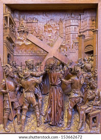 ANTWERP - SEPTEMBER 5: Jesus under cross. Carved relief as part of corss way cycle in St. Pauls church (Paulskerk) on September 5, 2013 in Antwerp, Belgium