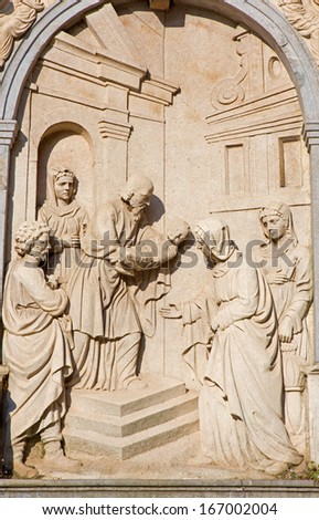 MECHELEN - SEPTEMBER 4: Relief of Presentation in the Temple from facade of gothic church Our Lady across de Dyle on September 4, 2013 in Mechelen, Belgium.