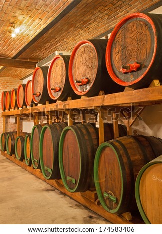 BRATISLAVA, SLOVAKIA - JANUARY 30, 2014: Carved casks in wine cellar of great Slovak producer.