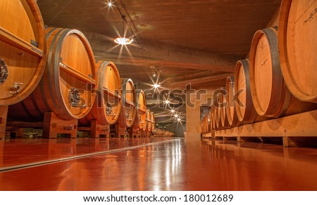 TRNAVA, SLOVAKIA - MARCH 3, 2014: Wooden casks in modern wine cellar of great Slovak producer \