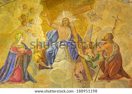 VENICE, ITALY - MARCH 11, 2014: Exterior mosaic from st. Mark cathedral over the main portal. Jesus the King in the heaven and hl. Mary and st. John the Baptist.