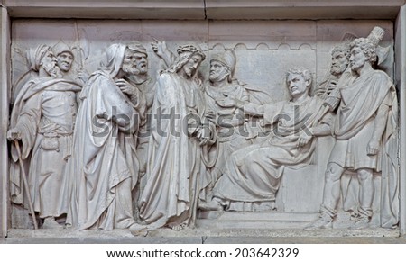 MECHELEN, BELGIUM - JUNE 14, 2014: Stone relief Jesus from Pilate in church Our Lady across de Dyle.