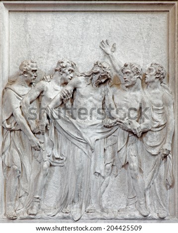BRUSSELS, BELGIUM - JUNE 15, 2014: Stone relief  Jesus Stripped of His Garments scene in church Notre Dame du Bon Secource.