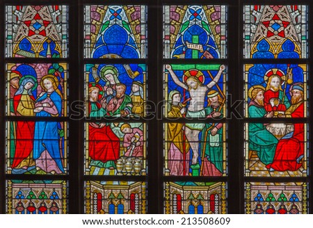 BRUGES, BELGIUM - JUNE 12, 2014: The New Testament scenes on windowpane in St. Salvator\'s Cathedral (Salvatorskerk) by stained glass artist Samuel Coucke (1833 - 1899)
