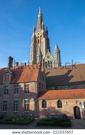 Bruges - Church of Our Lady from yard of Saint John Hospital (Sint Janshospitaal) in evening light