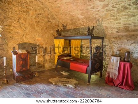 SPISSKY CASTLE, SLOVAKIA - JULY 19, 2014: The medieval bedroom in the castle.