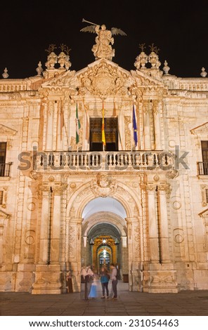 Seville - The facade of University fromer Tobacco Factory at night.