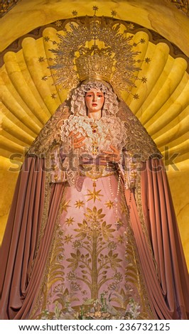 SEVILLE, SPAIN - OCTOBER 28, 2014: The cried Virgin Mary statue on the main altar in church Iglesia de Santa Maria de los Angeles.
