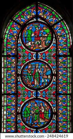 PARIS, FRANCE - JUNE 16, 2011: The windowpane from Saint Denis gothic church with the scenes from French history.