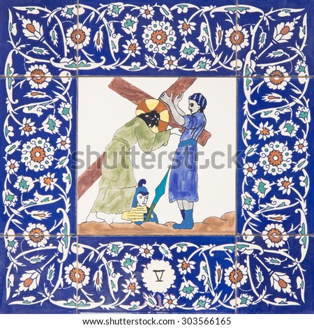 JERUSALEM, ISRAEL - MARCH 5, 2015: The ceramic tiled station of Cross way in st. George anglicans church from 20. cent. by unknown artist.Simon of Cyrene help Jesus to carry his cross.