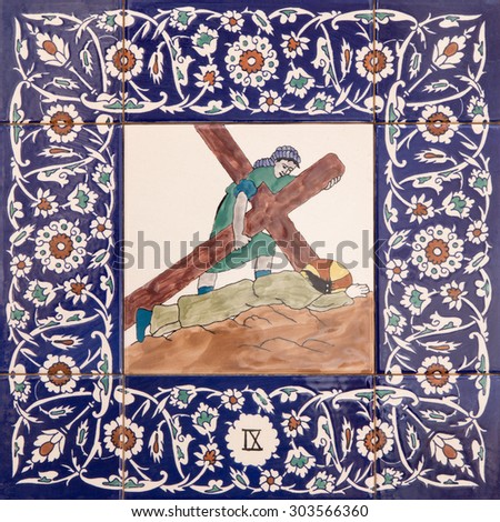 JERUSALEM, ISRAEL - MARCH 5, 2015: The ceramic tiled station of Cross way in st. George anglicans church from 20. cent. by unknown artist.  Jesus fall under cross.