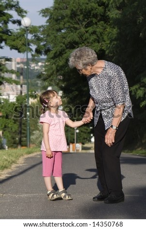 grandmother and grandchild by the walk