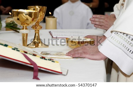 hands of priest by the mass