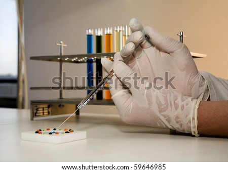 hands by work in laboratory