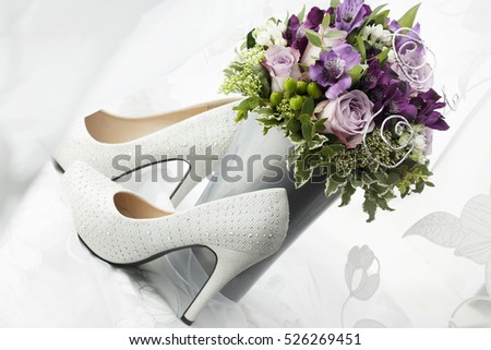 Bouquet and wedding shoes bride.