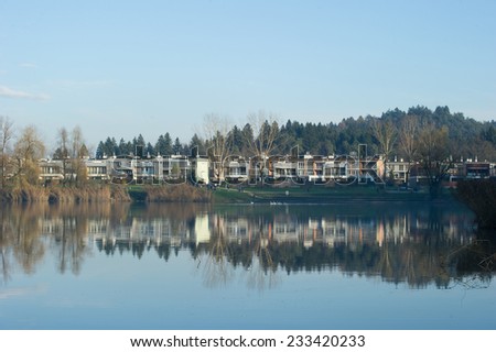 Apartment complex near an artificial lake in the city.