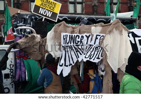 COPENHAGEN - DEC 12: Tens of thousands of people demonstrate in the Danish capital for speedy action by the UN climate conference to halt global warming on December 12, 2009 in Copenhagen, Denmark.